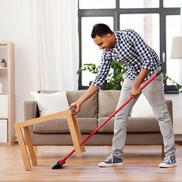 Men cleaning vinyl floor | Haight Carpet & Interiors